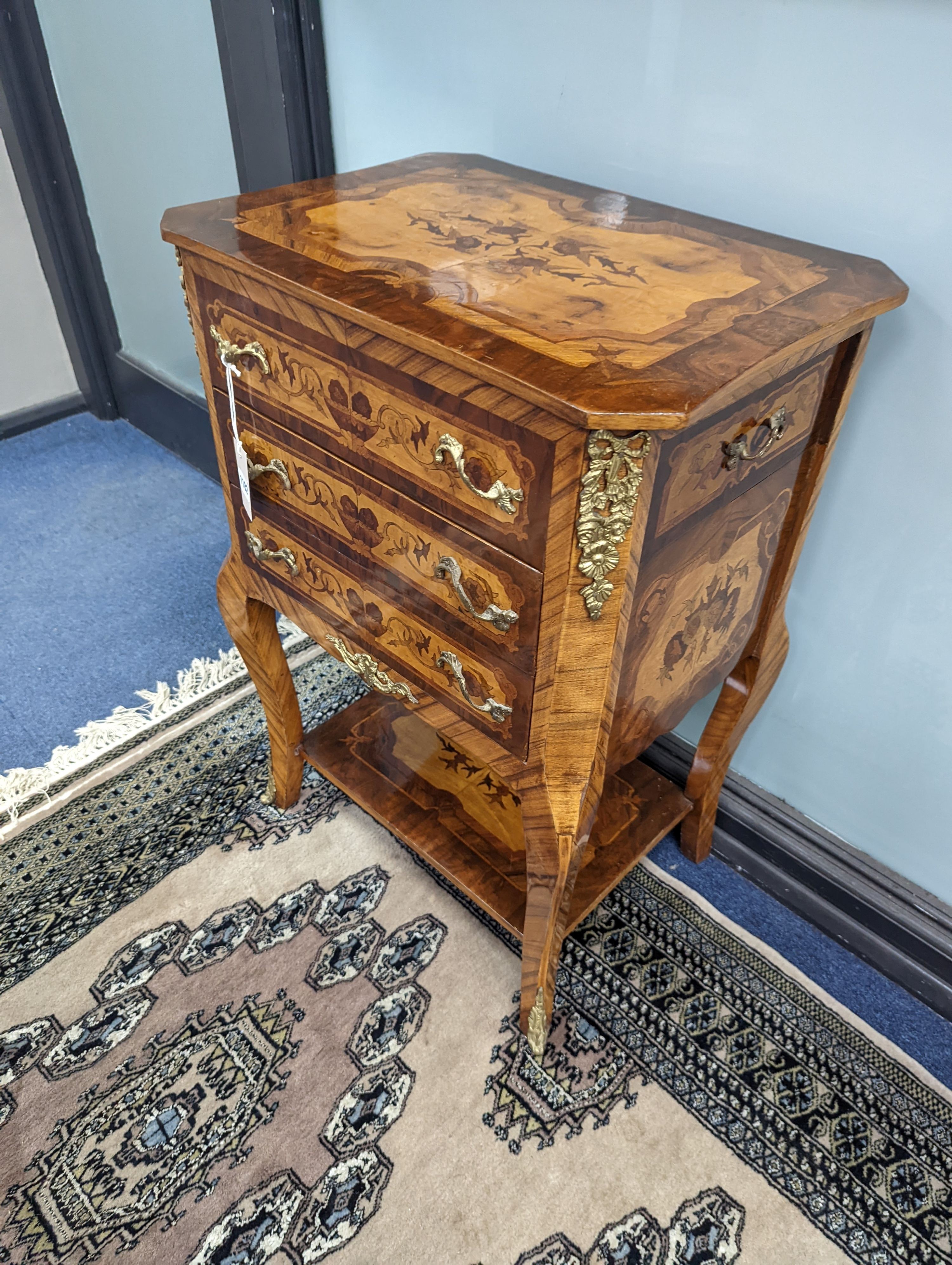 A pair of Louis XVI style marquetry bedside chests, each fitted with a two side drawers above two front long drawers, width 53cm, height 75cm